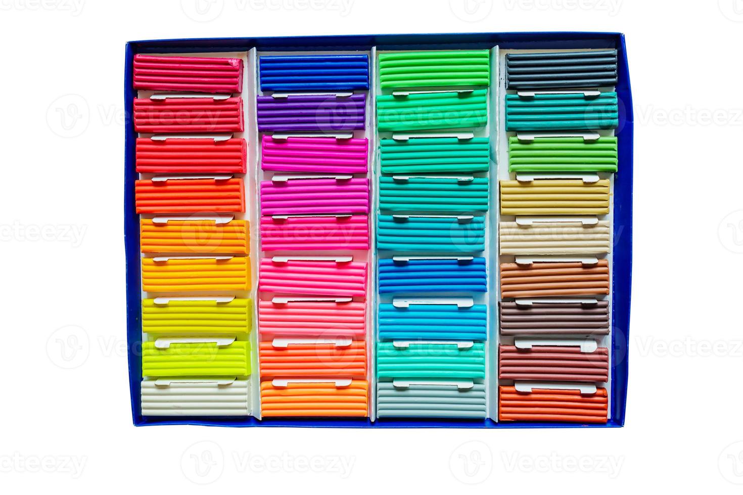 Modeling clay. Multicolored plasticine bars in a box isolated on white background. photo