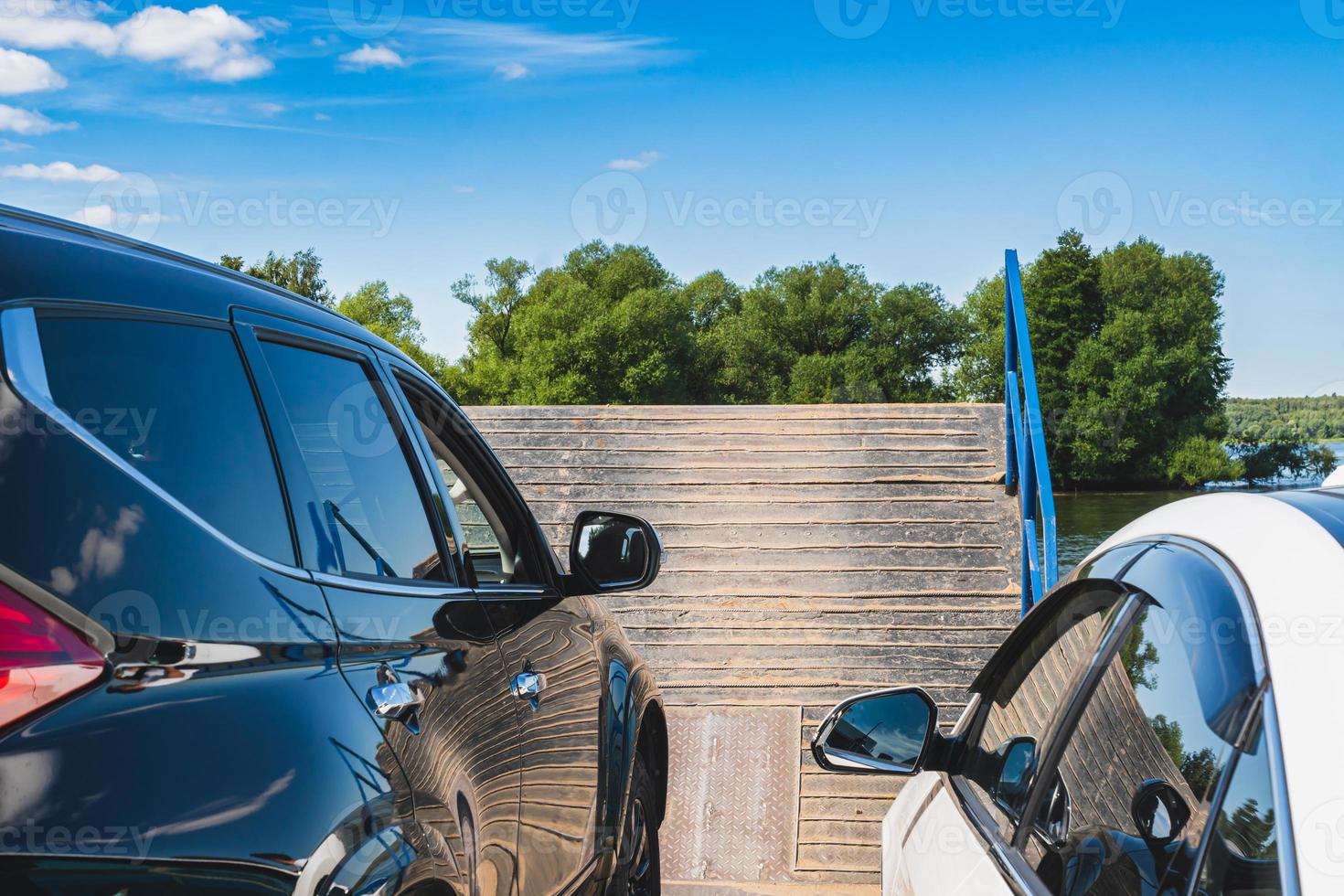 Boarding cars on a ferry crossing Volga rive in Konakovo, Russia. photo