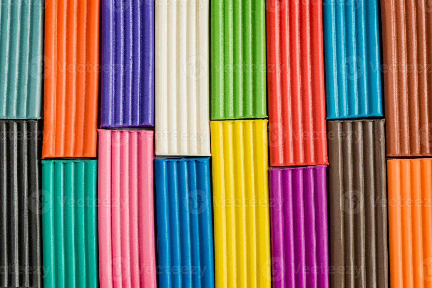 Rainbow colors of modeling clay. Multicolored plasticine bars  background. photo