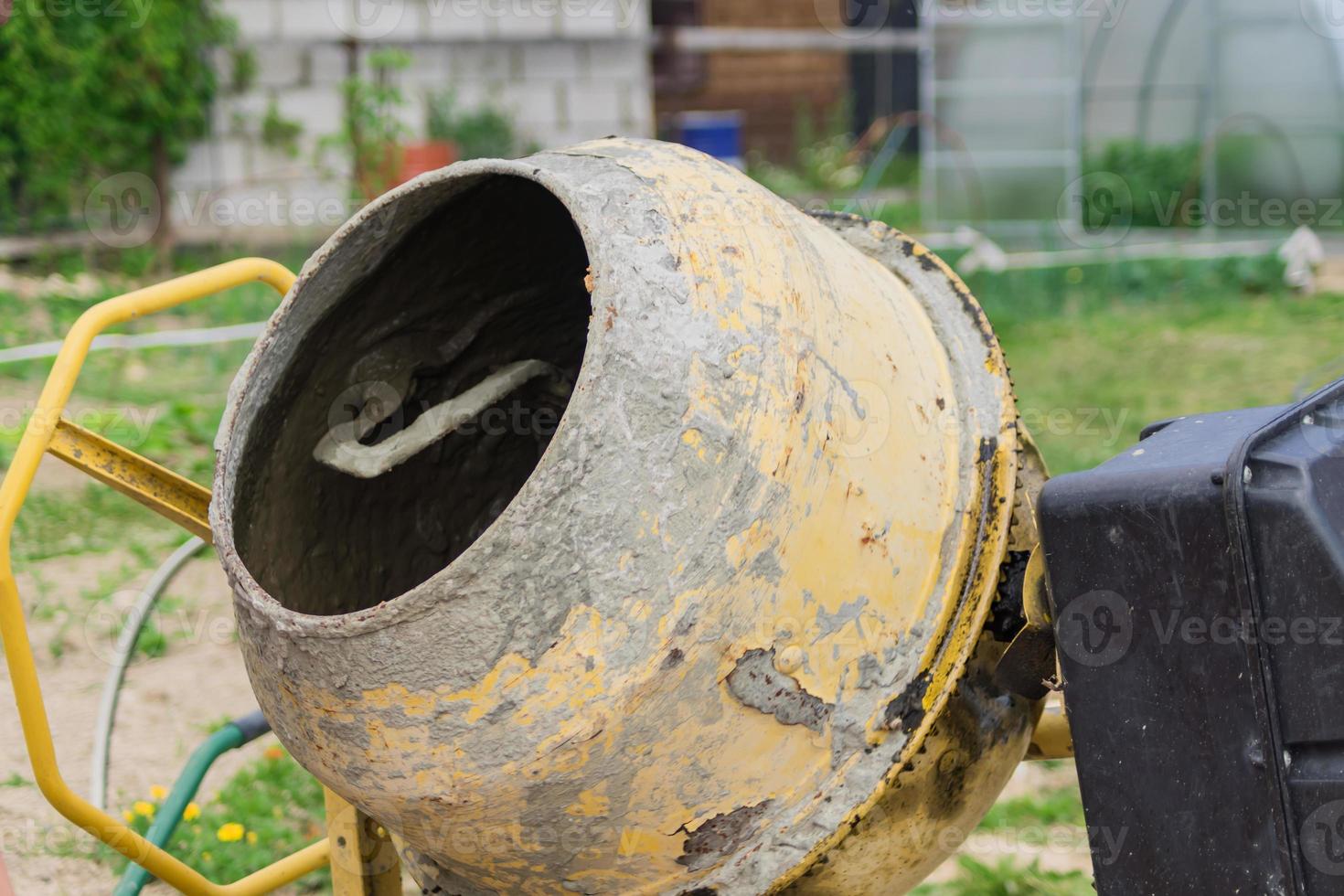 old dirty concrete mixer close up photo