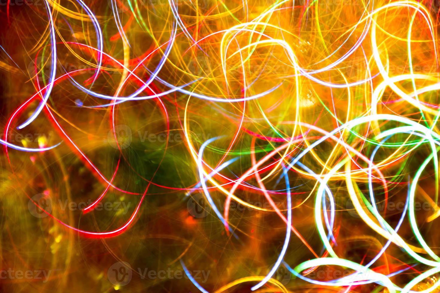 Abstract burred texture background of colorful bokeh motion. Long exposure of small neon lights photo