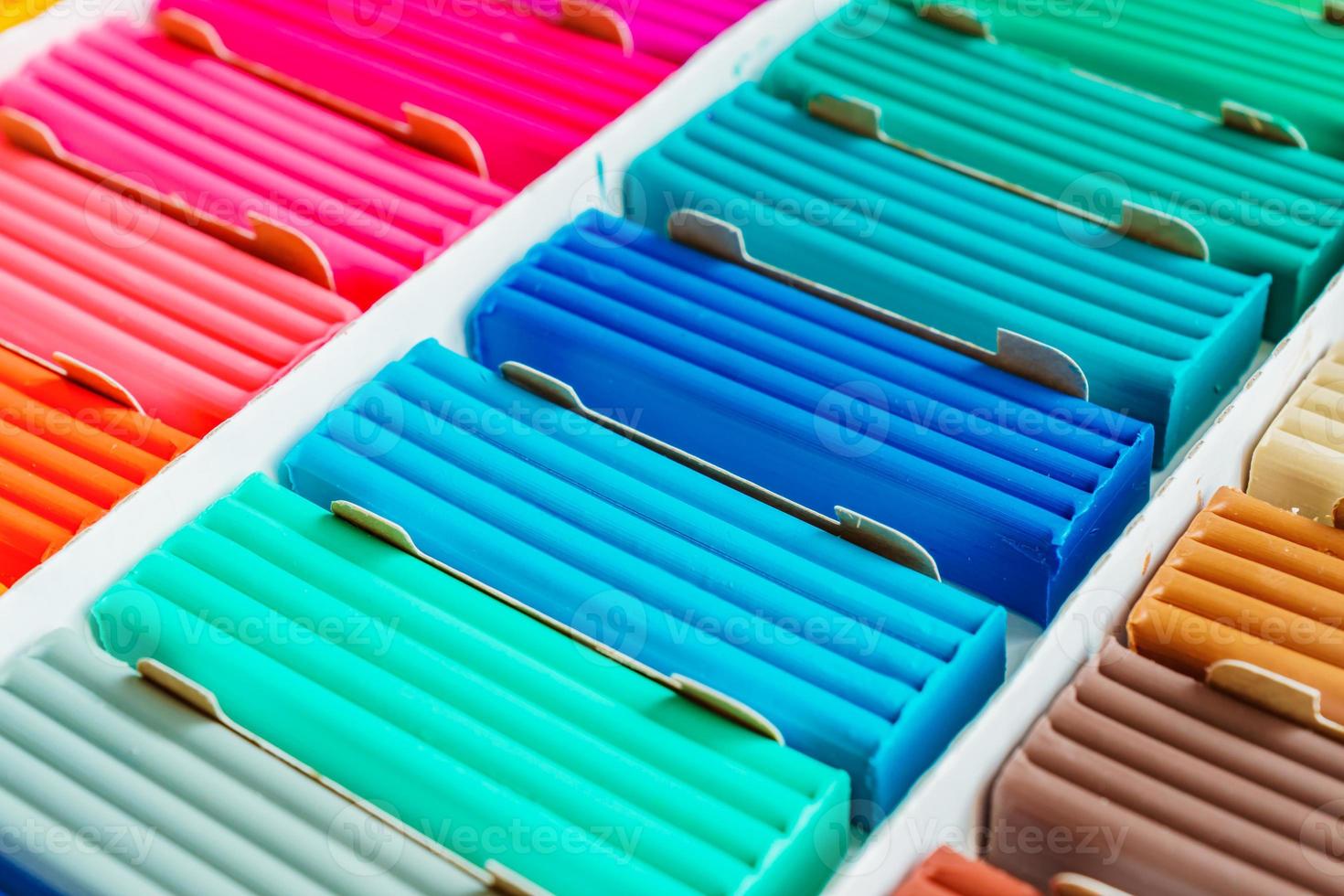 Bright colors of modeling clay. Multicolored plasticine bars ina box, background texture photo