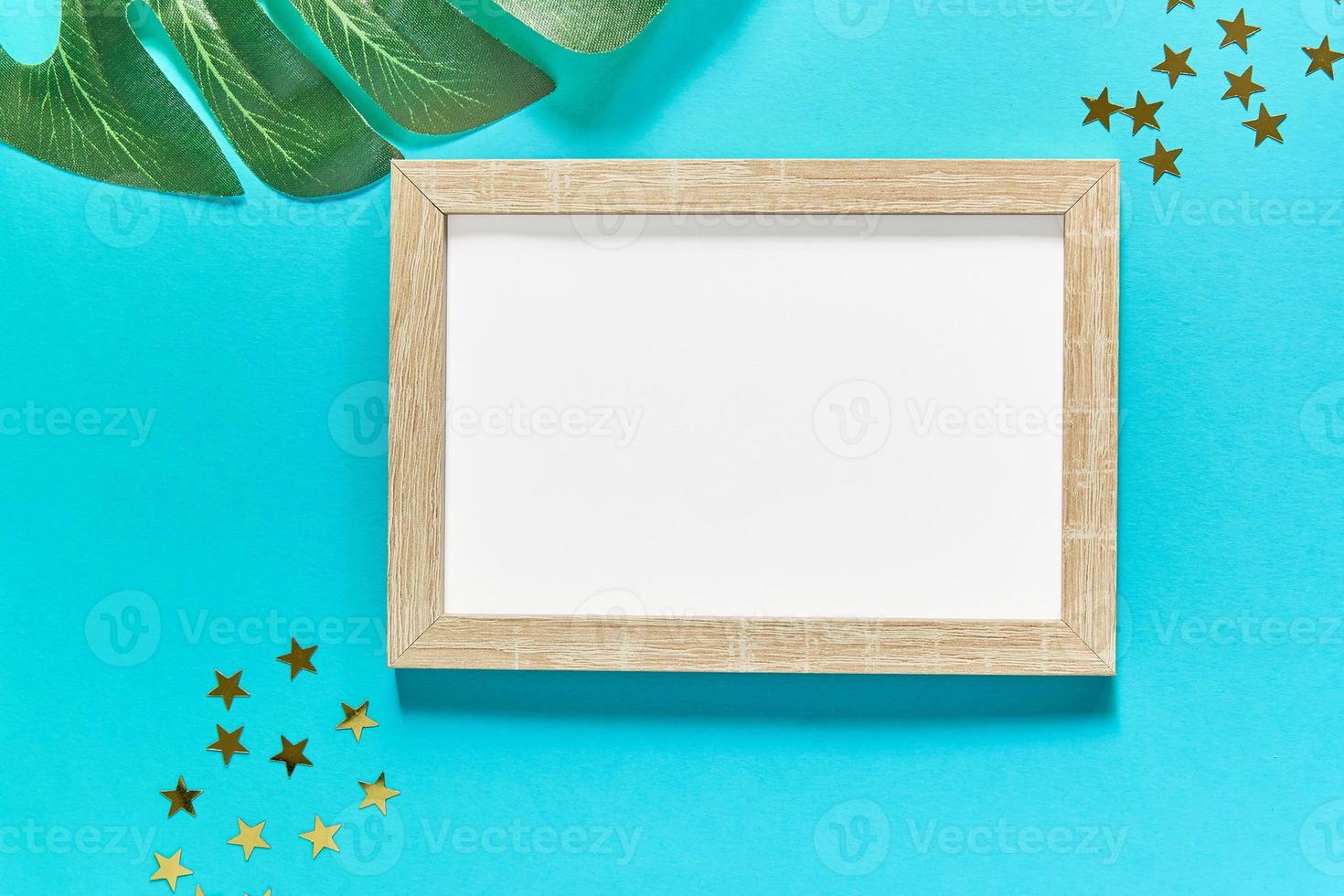 mockup frame with golden stars and monstera leaf photo