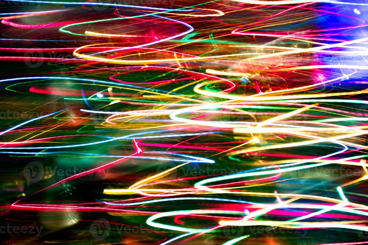 Abstract burred texture background of colorful bokeh motion. Long exposure of small neon lights photo