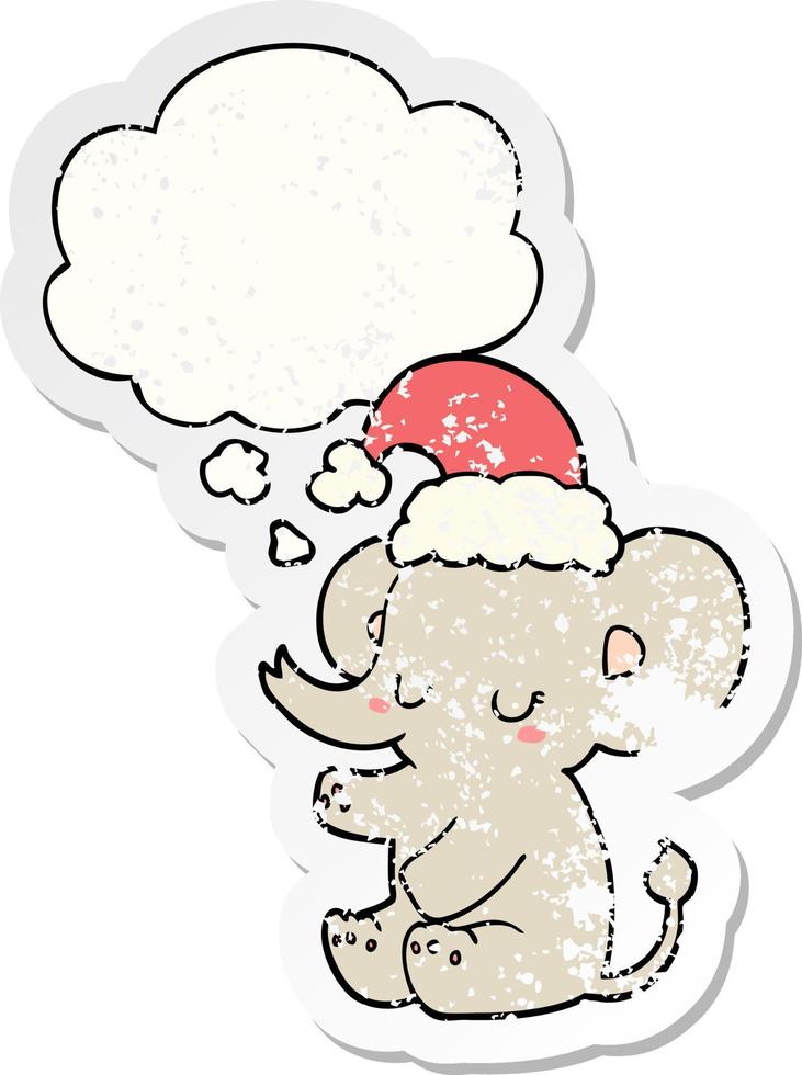 cute christmas elephant and thought bubble as a distressed worn sticker vector