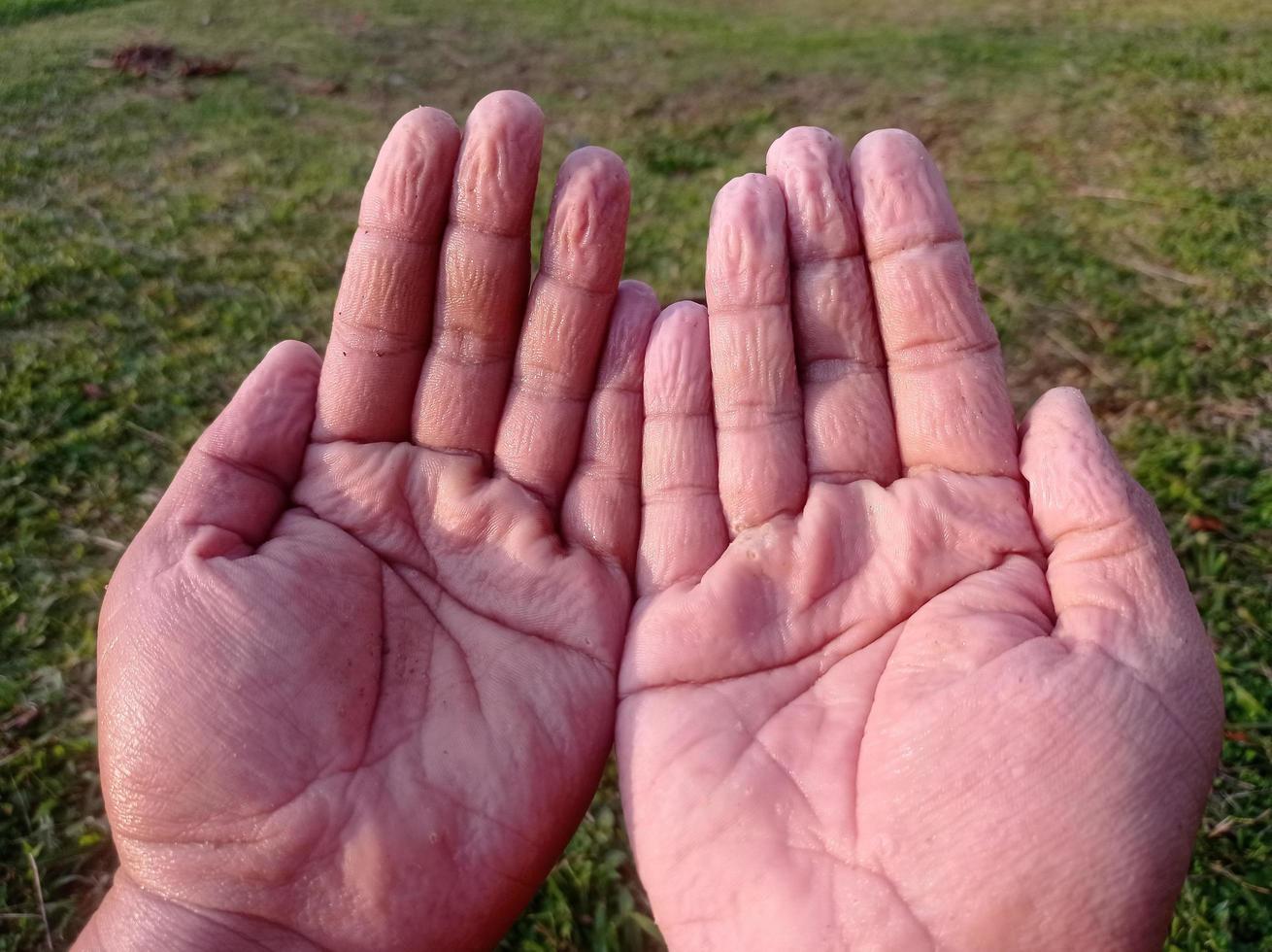 wrinkled finger a grown man after playing in water for too long photo