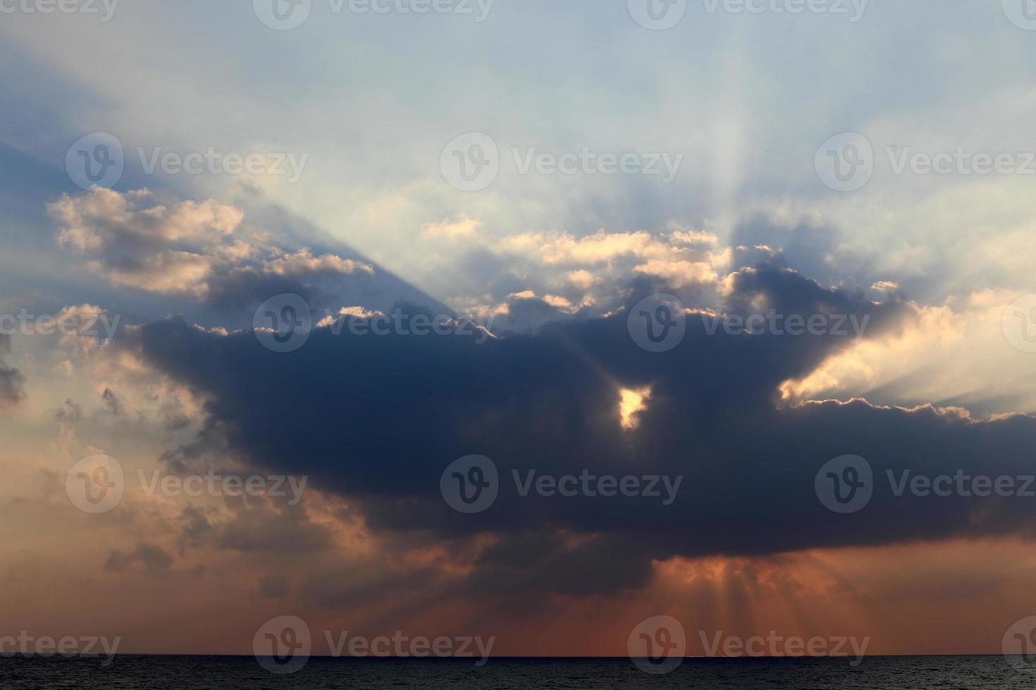 The sun sets below the horizon on the Mediterranean Sea in northern Israel. photo