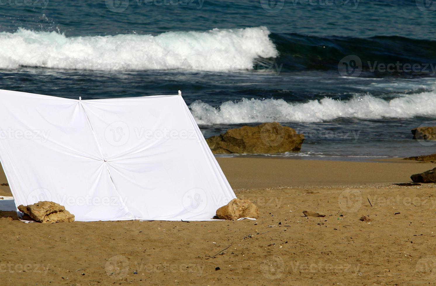 Tourist tent on the Mediterranean coast. photo