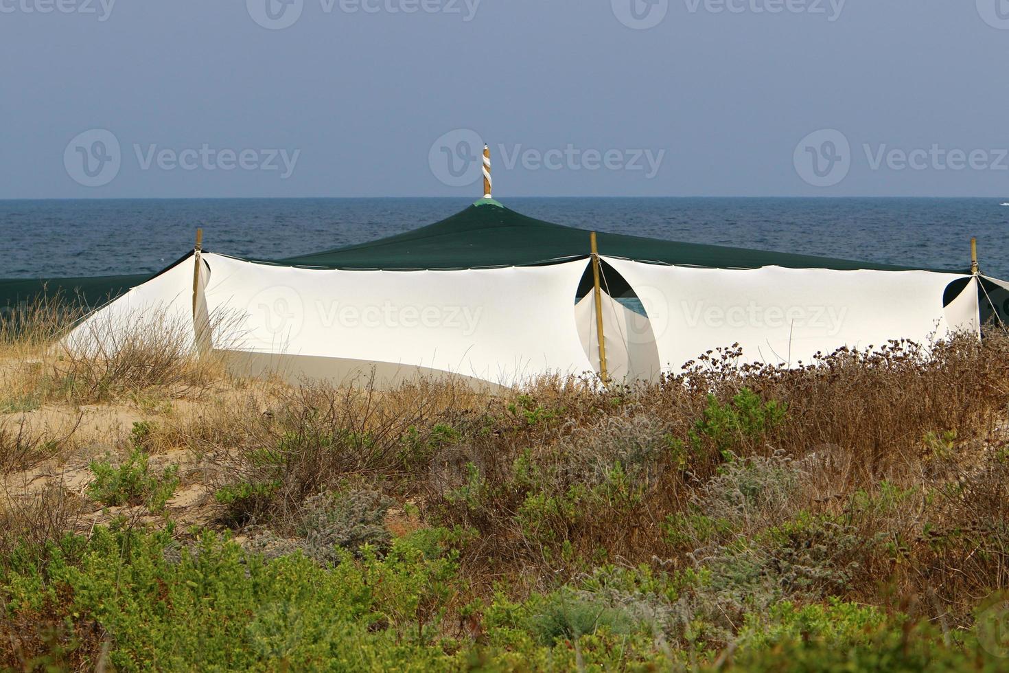 Tourist tent on the Mediterranean coast. photo