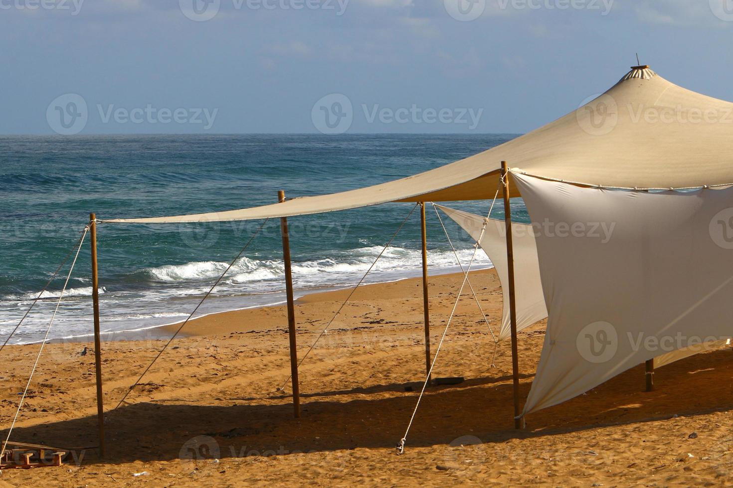 Tourist tent on the Mediterranean coast. photo