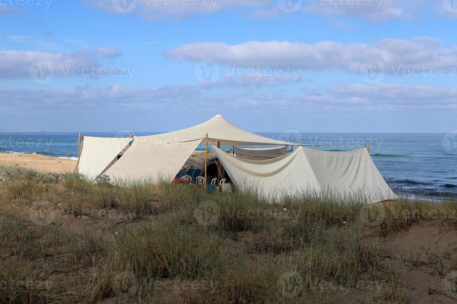 Tourist tent on the Mediterranean coast. photo