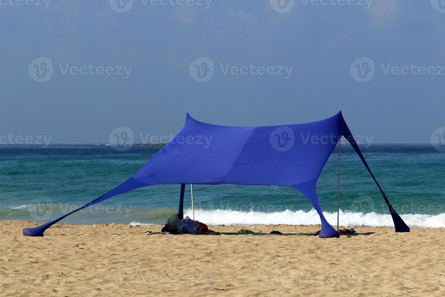 Tourist tent on the Mediterranean coast. photo