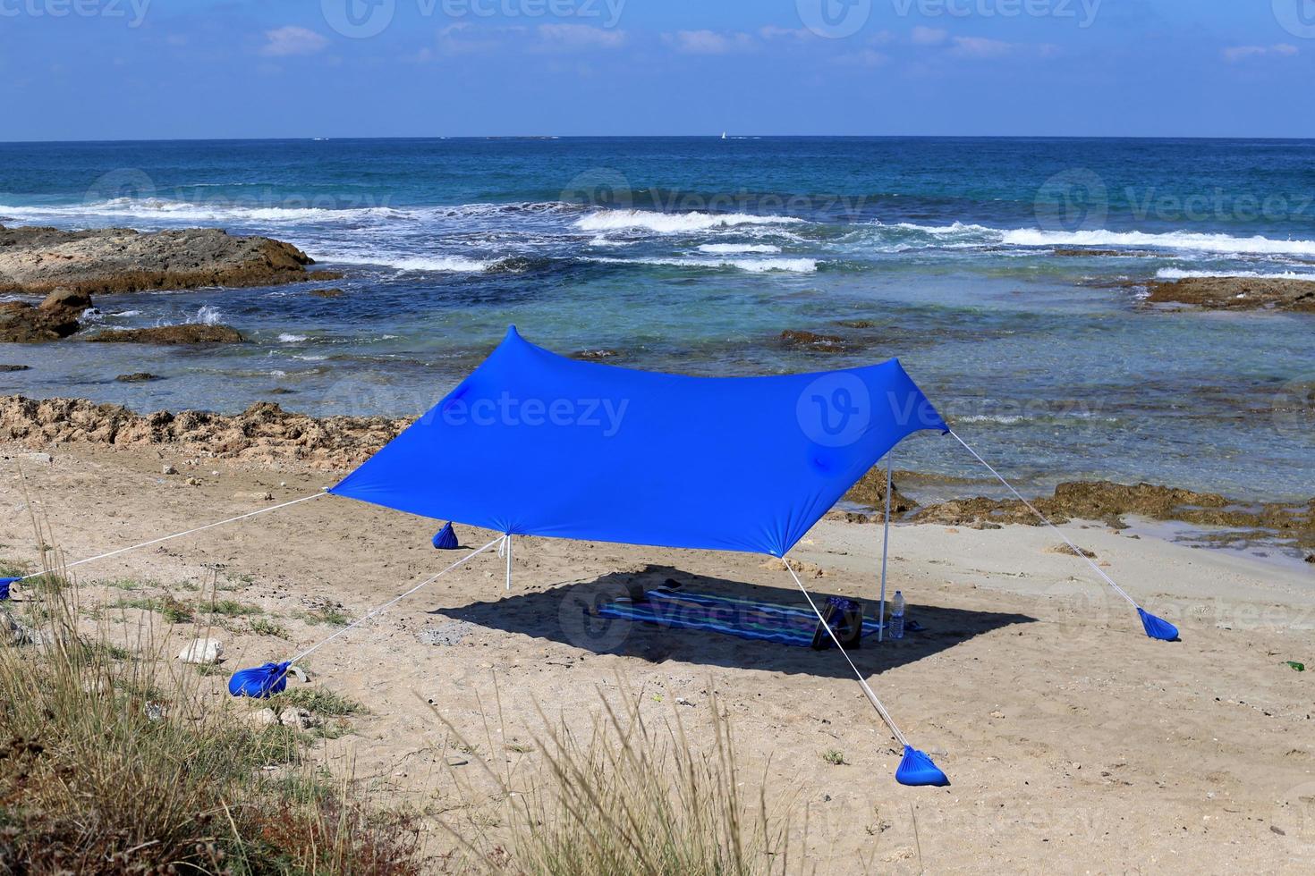Tourist tent on the Mediterranean coast. photo