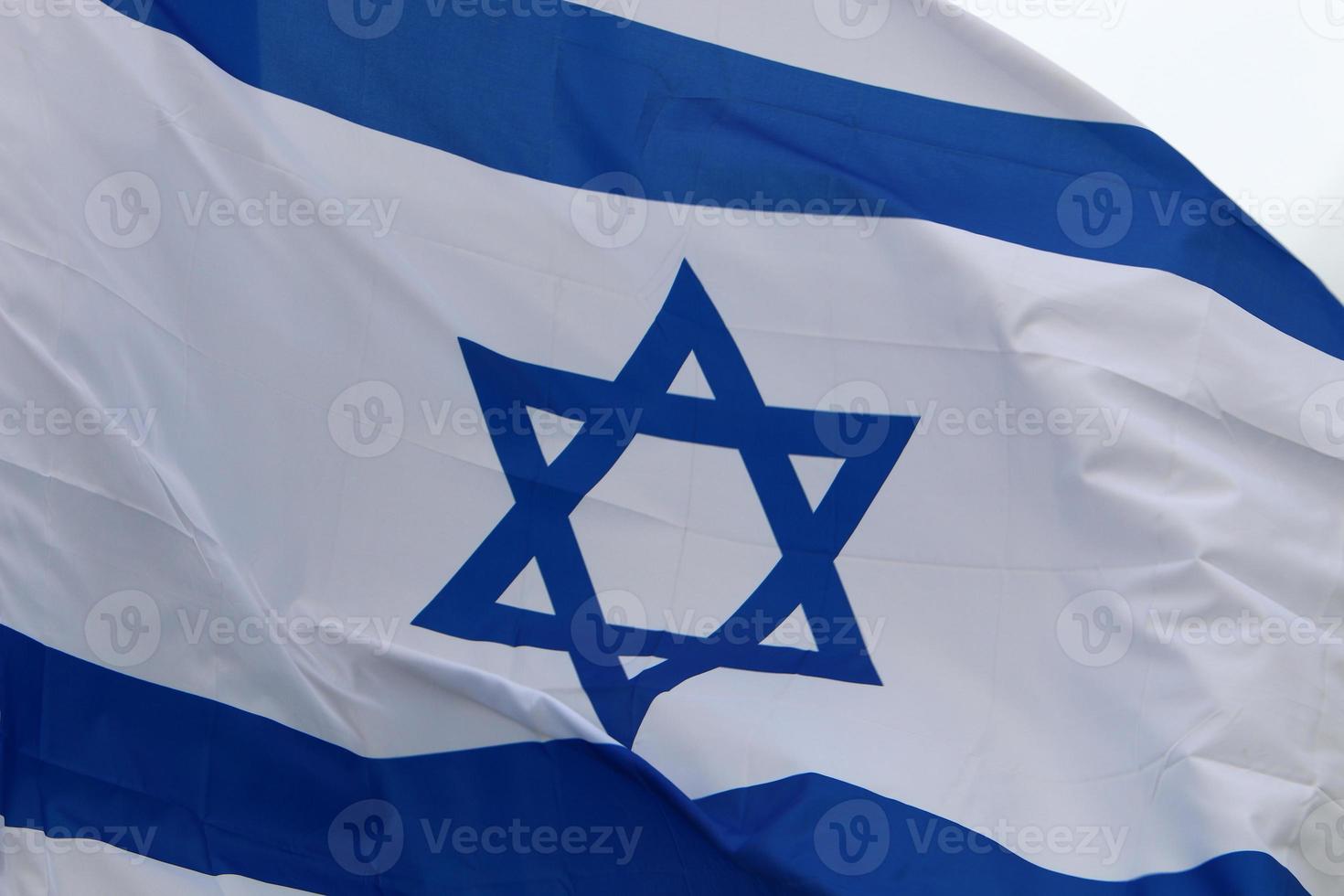 The blue and white Israeli flag with the Star of David. photo