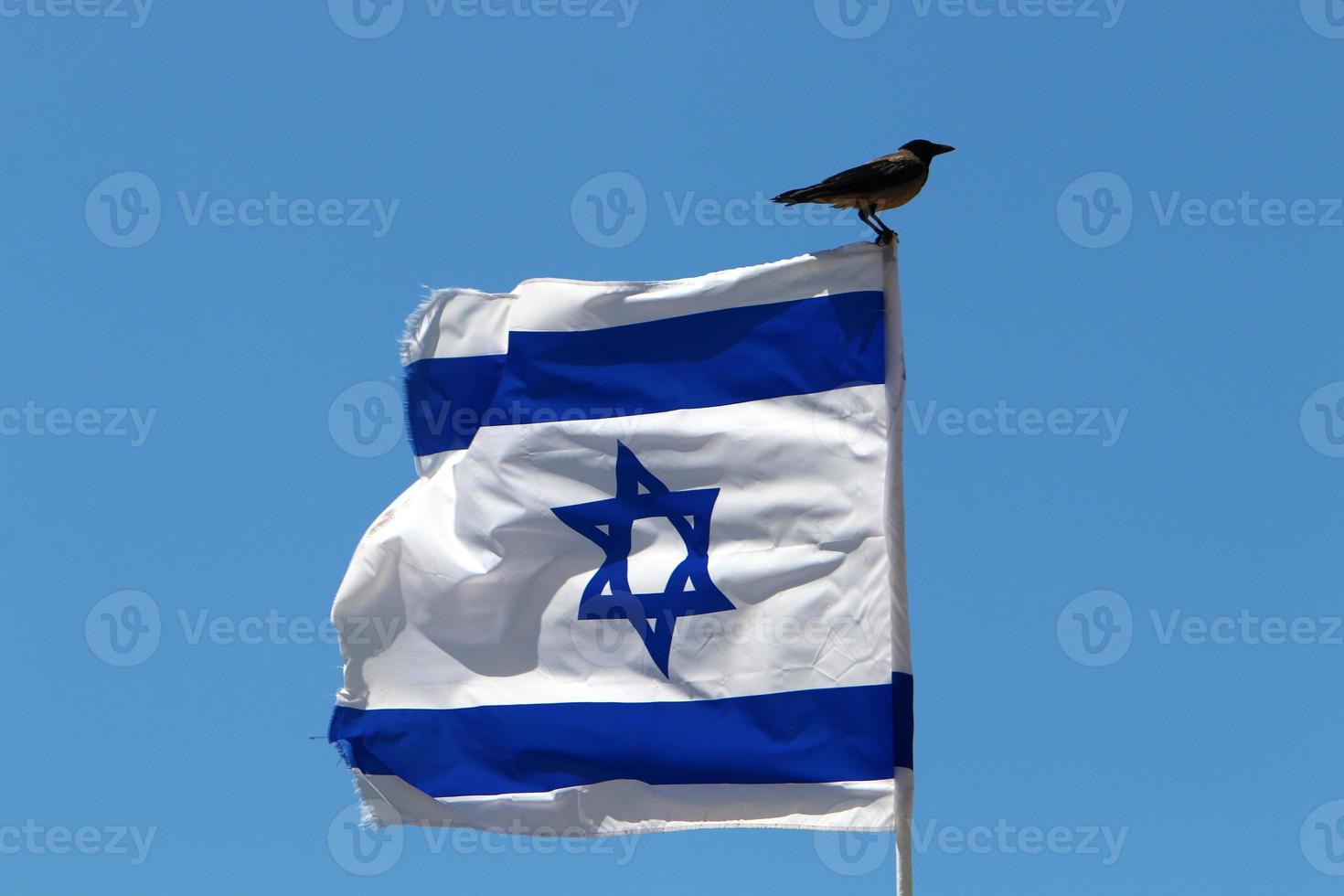 The blue and white Israeli flag with the Star of David. photo