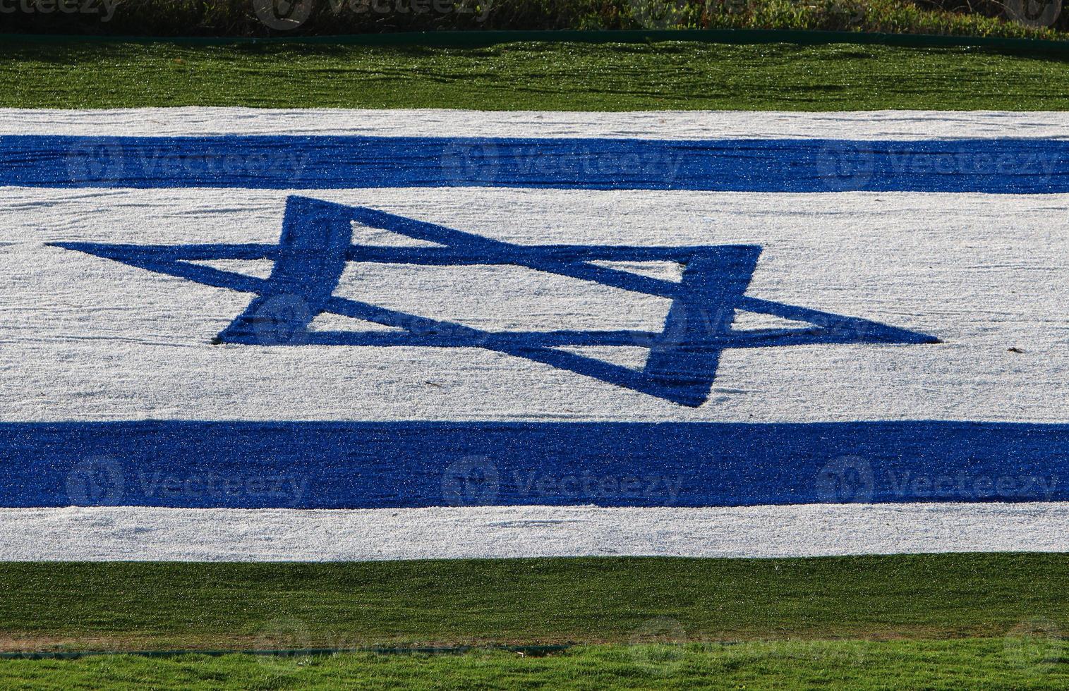 The blue and white Israeli flag with the Star of David. photo