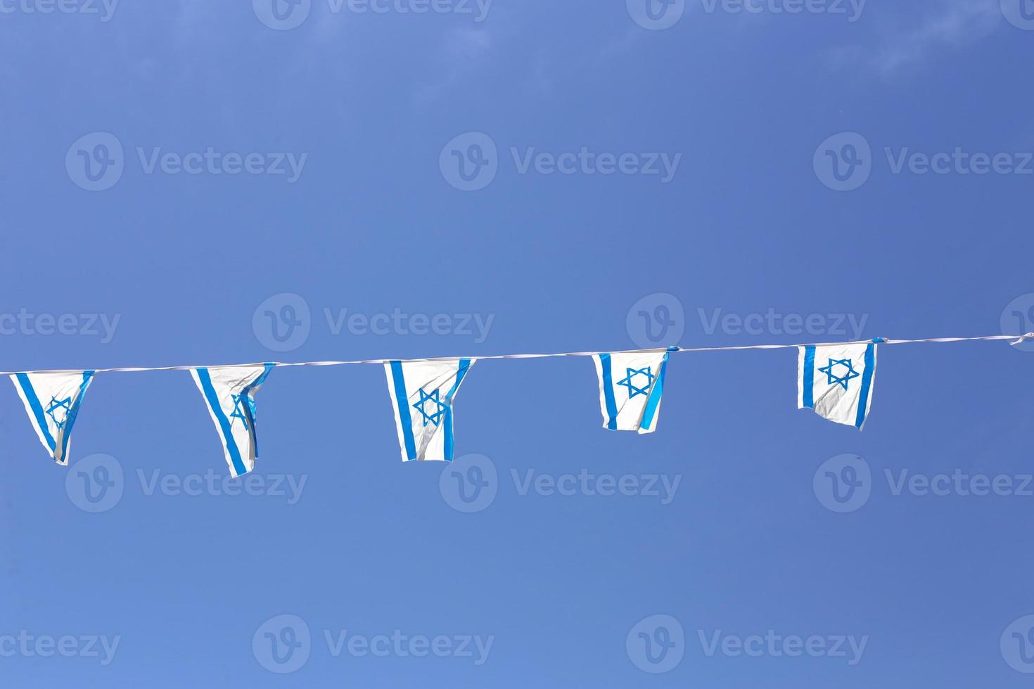 The blue and white Israeli flag with the Star of David. photo