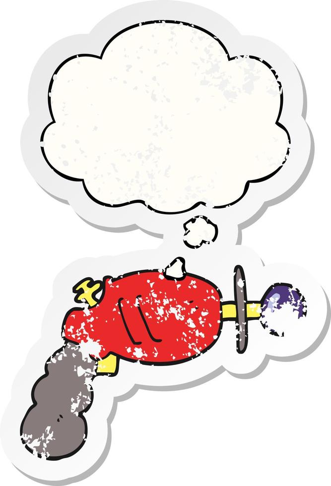 cartoon ray gun and thought bubble as a distressed worn sticker vector