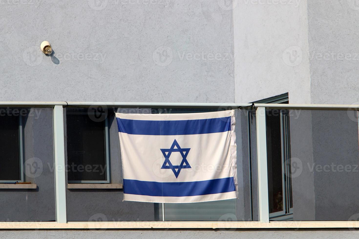 The blue and white Israeli flag with the Star of David. photo