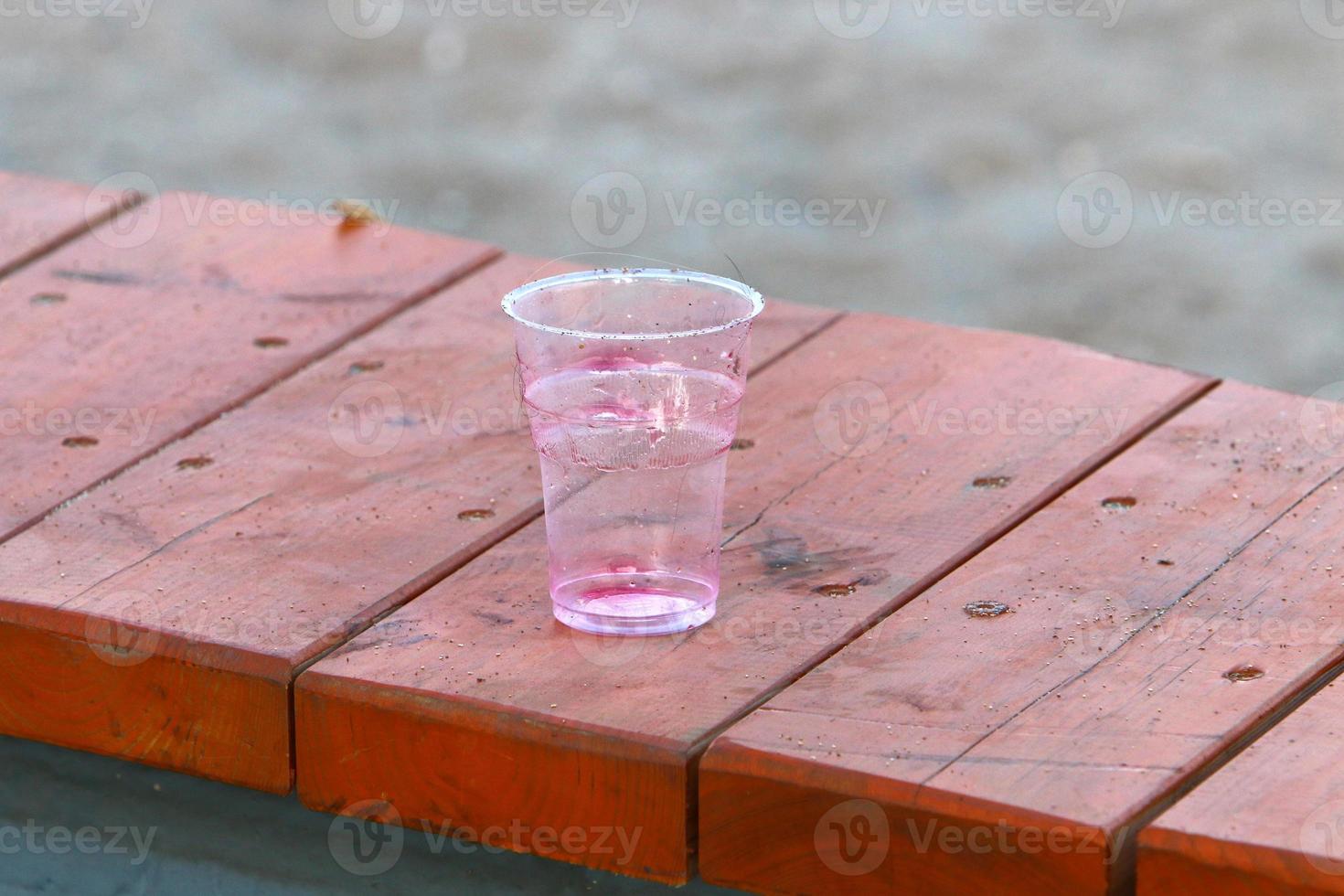 On the table in a glass of soft drinks. photo