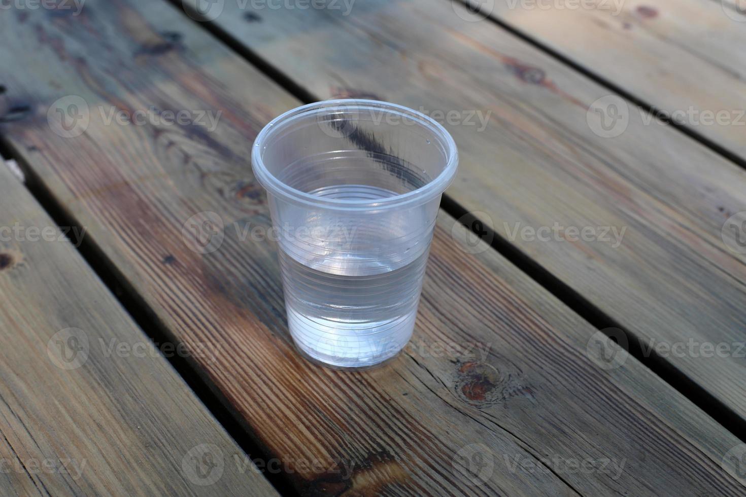 On the table in a glass of soft drinks. photo