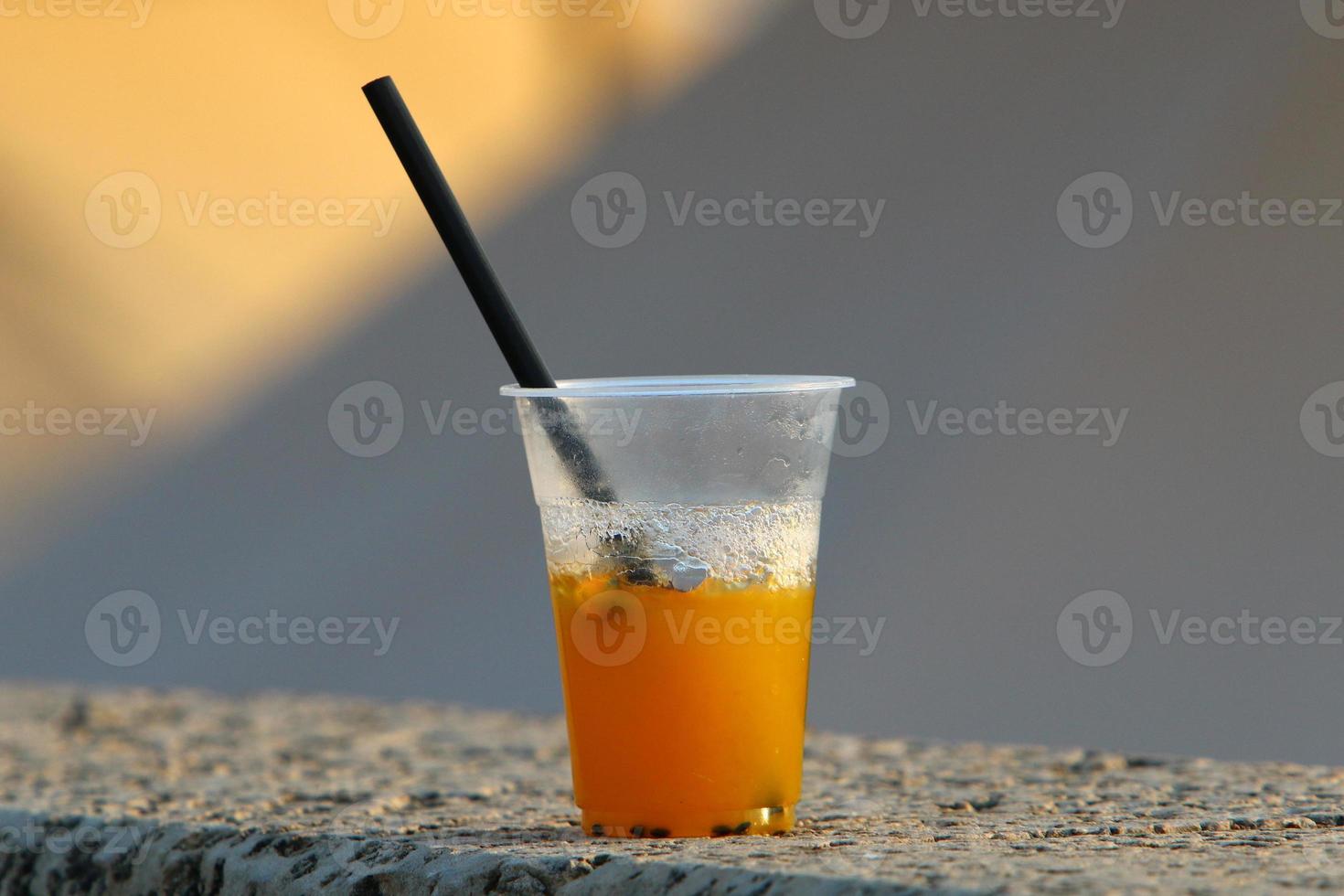 On the table in a glass of soft drinks. photo