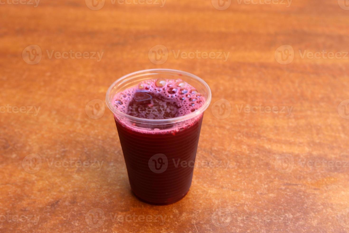 On the table in a glass of soft drinks. photo