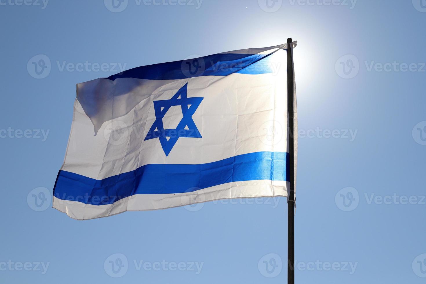 The blue and white Israeli flag with the Star of David. photo