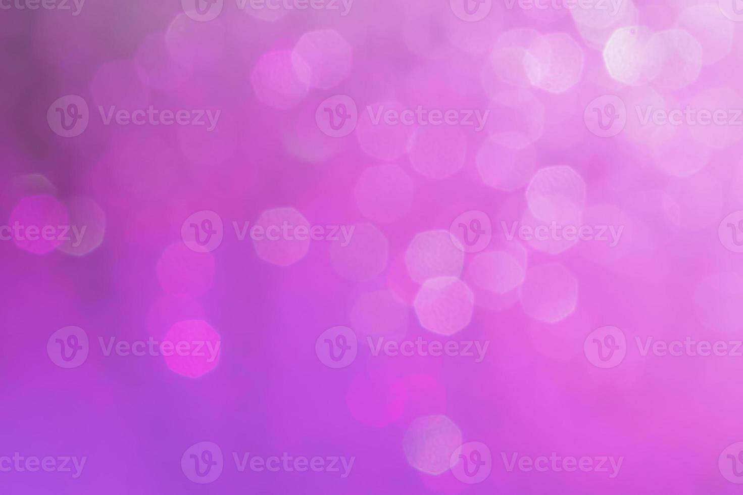 Bokeh abstract texture. Beautiful christmas background in purple colors. Defocused photo
