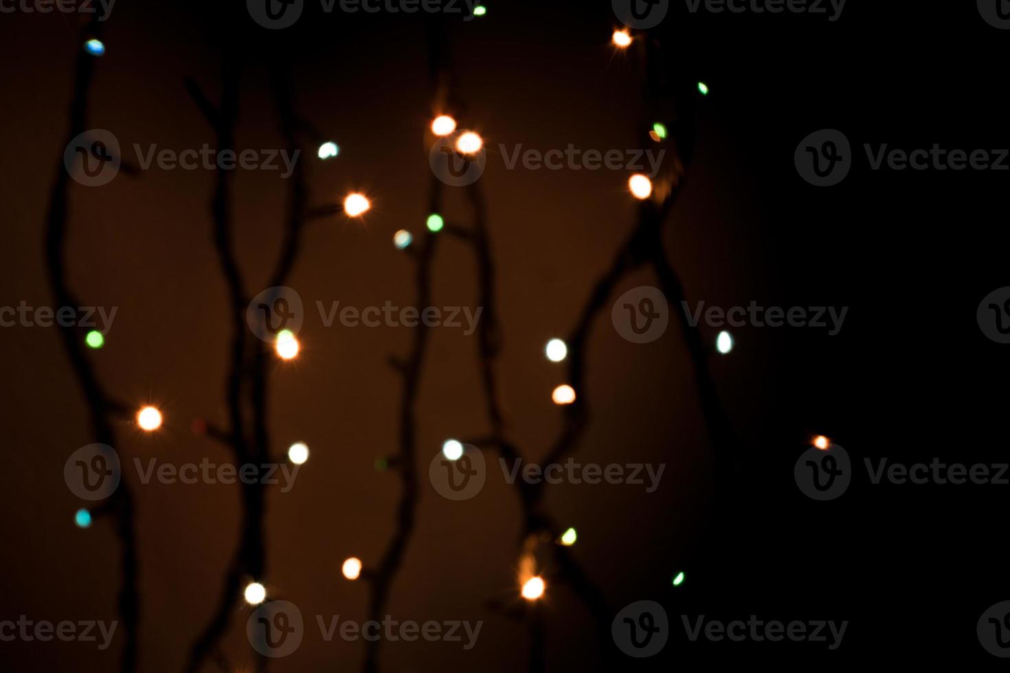 Multicolored abstract bokeh on black background photo