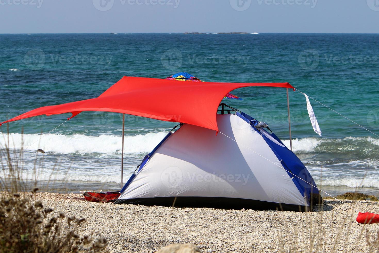 Tourist tent on the Mediterranean coast. photo