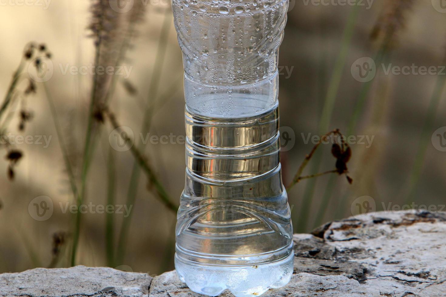 On the table in a glass of soft drinks. photo