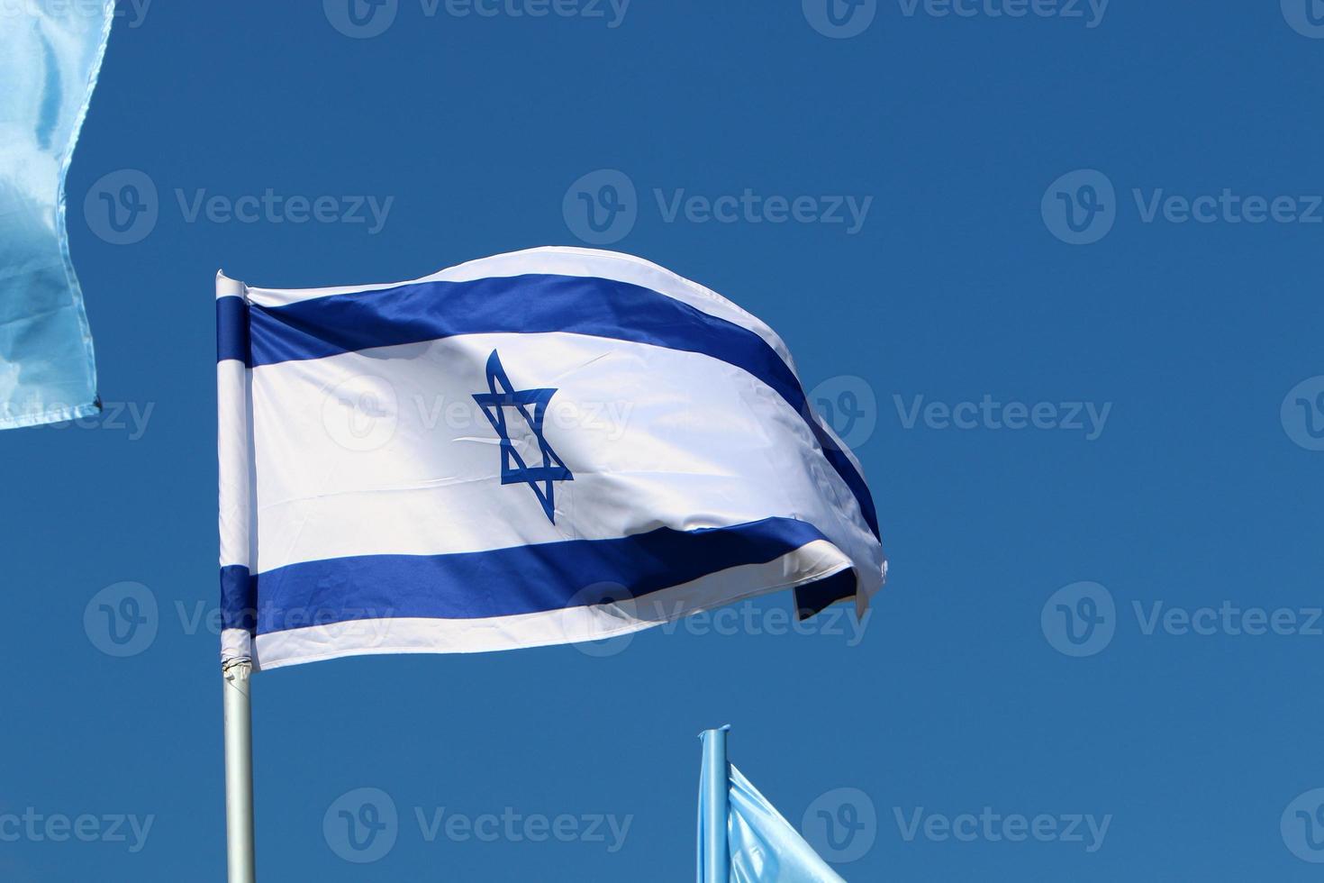 The blue and white Israeli flag with the Star of David. photo