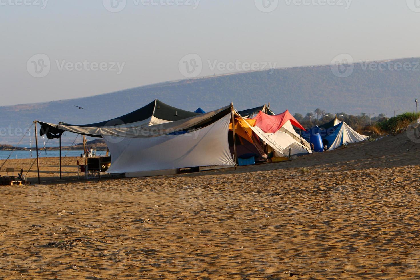 Tourist tent on the Mediterranean coast. photo