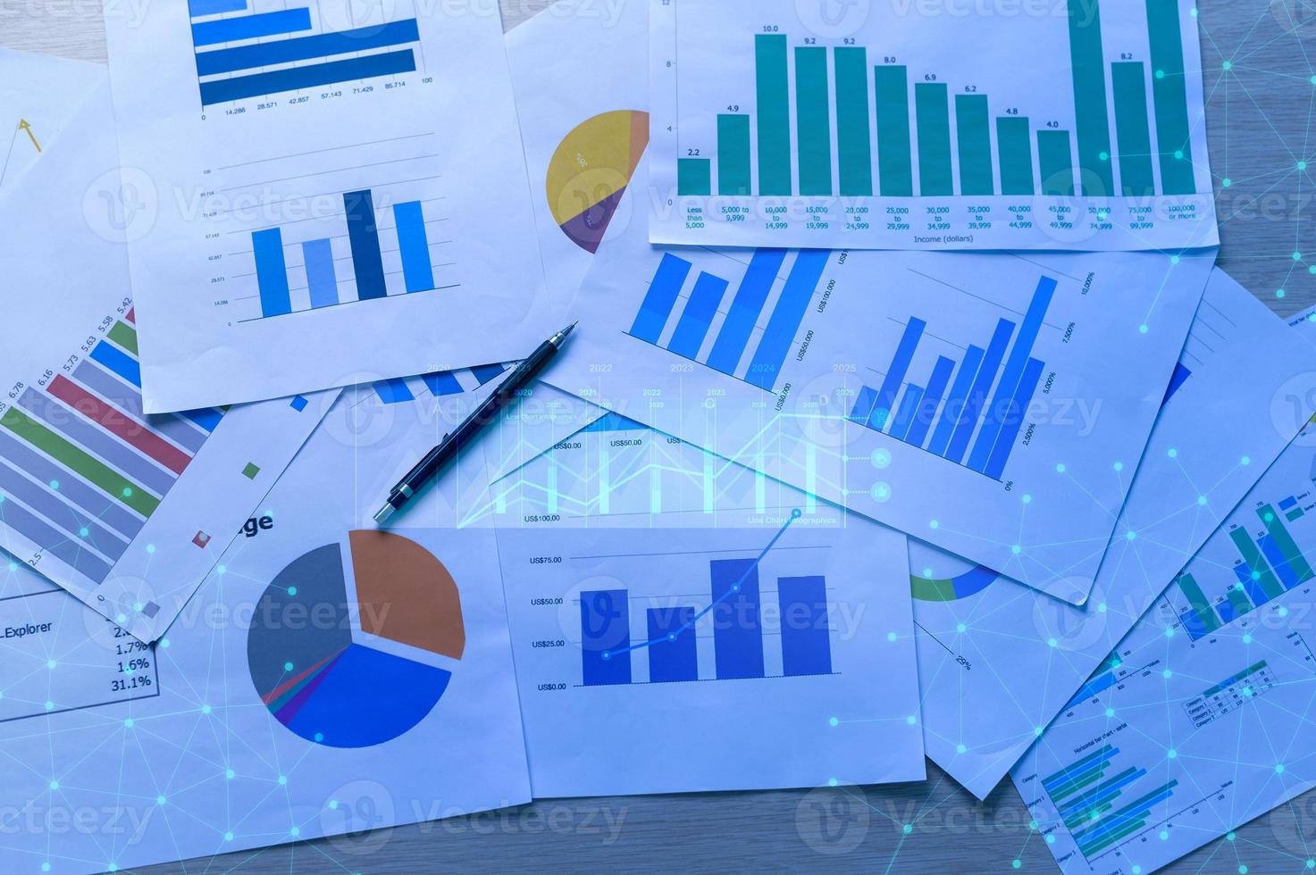 Background of documents with analytics data lying on table photo