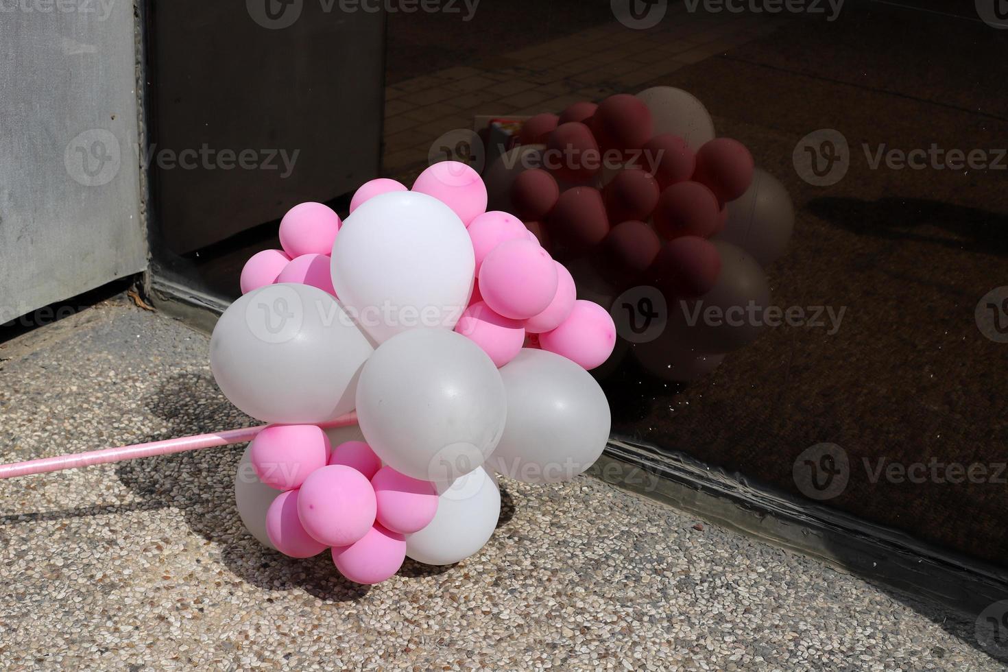 Balloons in a city park on the seashore. photo