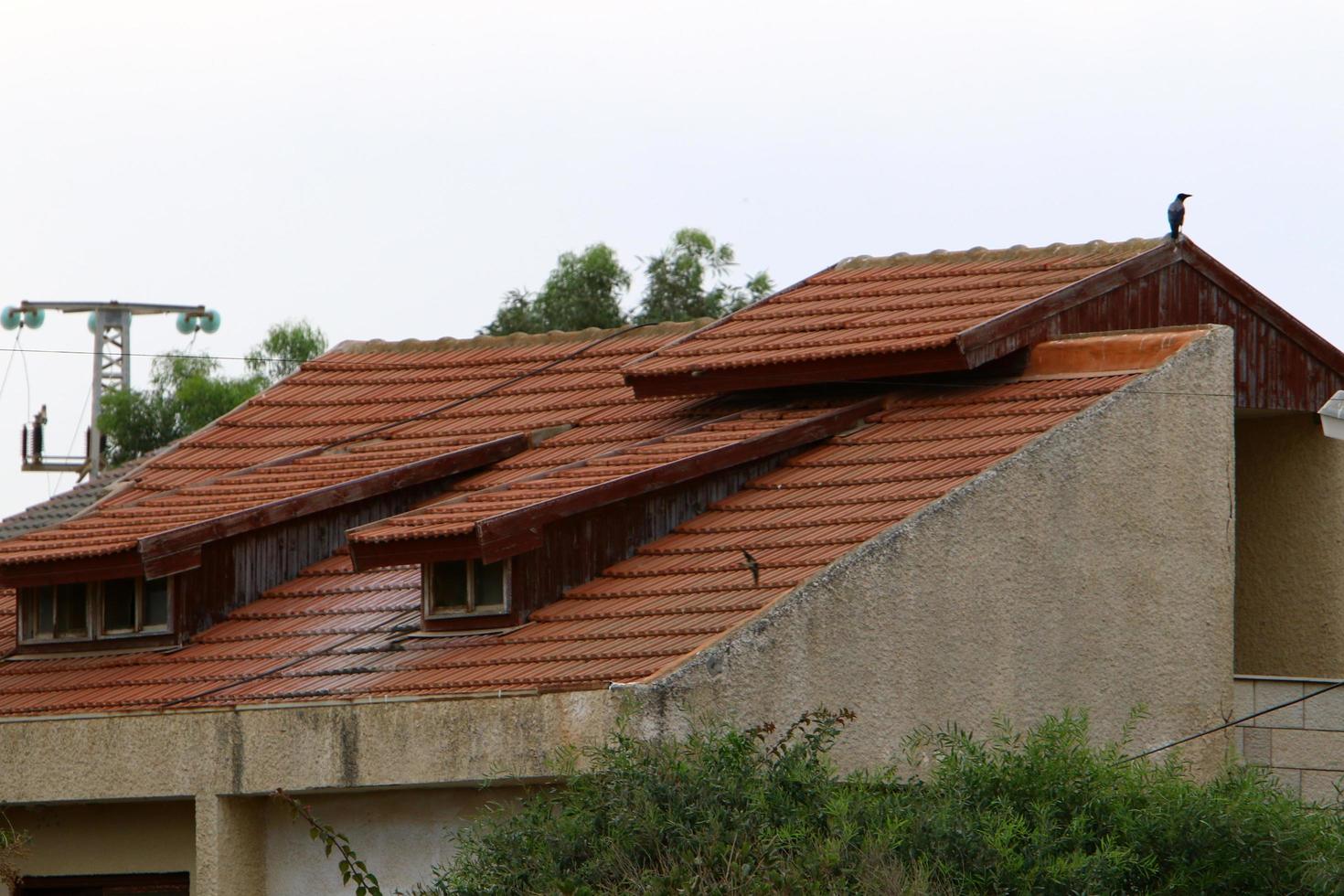Karmiel Israel August 20, 2021. Red tiled roof of a residential building photo