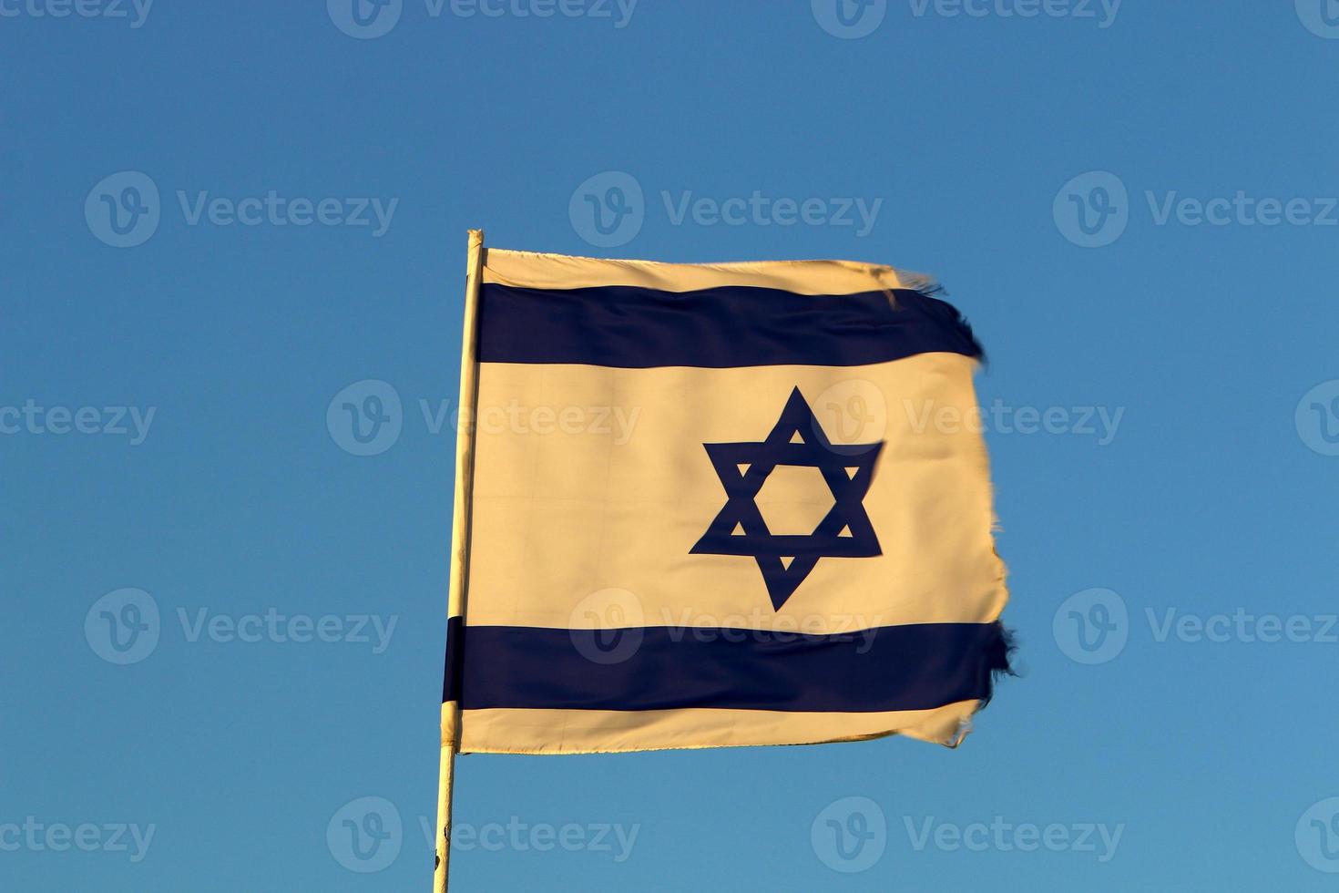 The blue and white Israeli flag with the Star of David. photo