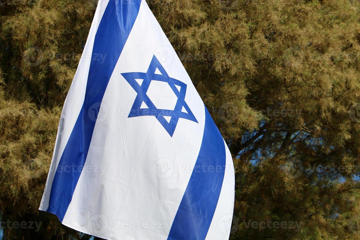 The blue and white Israeli flag with the Star of David. photo