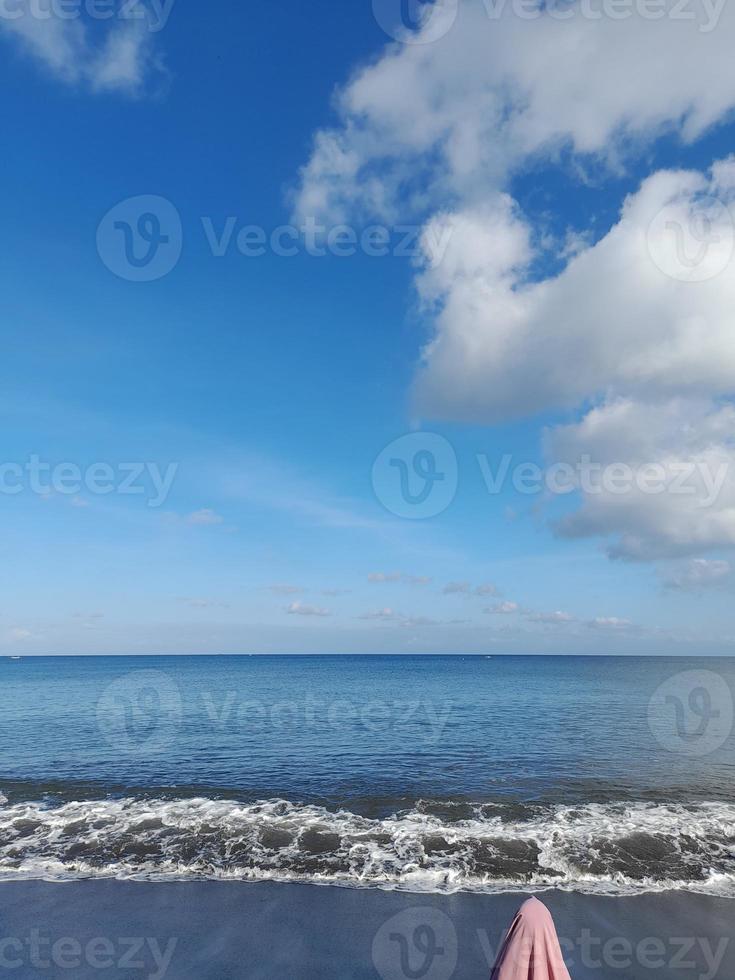 Beach atmosphere in the morning with a bright blue sky on the island of Lombok, Indonesia photo