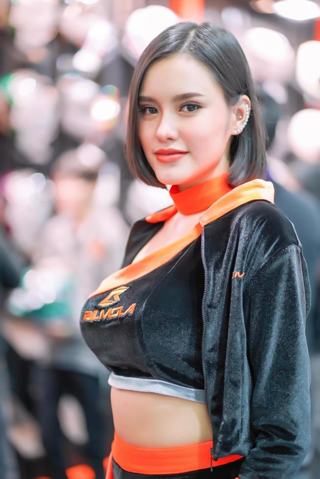 Nonthaburi, Thailand - DEC 3, 2019 Unidentified model poses with a car at The 36th Motor Expo Thailand 2019 at IMPACT Arena, Muang Thong Thani, Nonthaburi, Thailand. photo