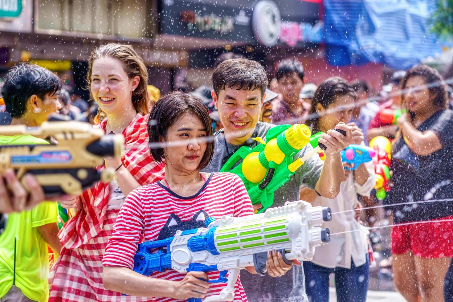 Siam Square, Bangkok, Thailand - APR 13, 2019 short action of people joins celebrations of the Thai New Year or Songkran in Siam Square. photo