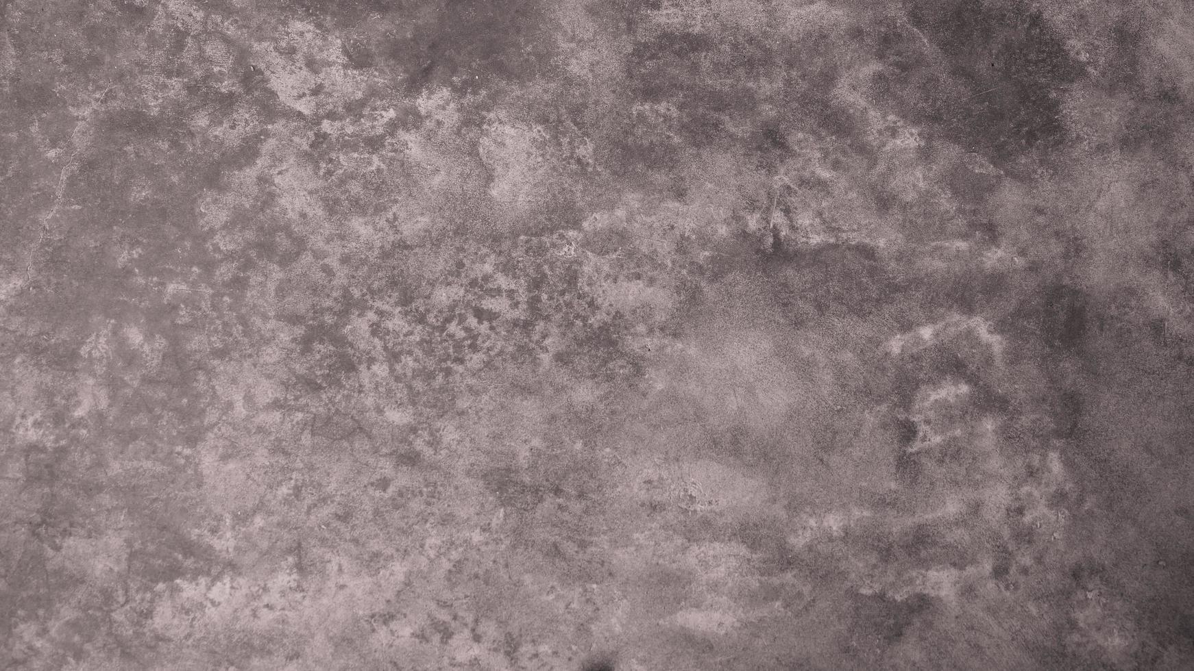 The old cement wall was weathered, the surface was scratched, the surface was scratched and damaged. For a mysterious retro-conservative background. photo