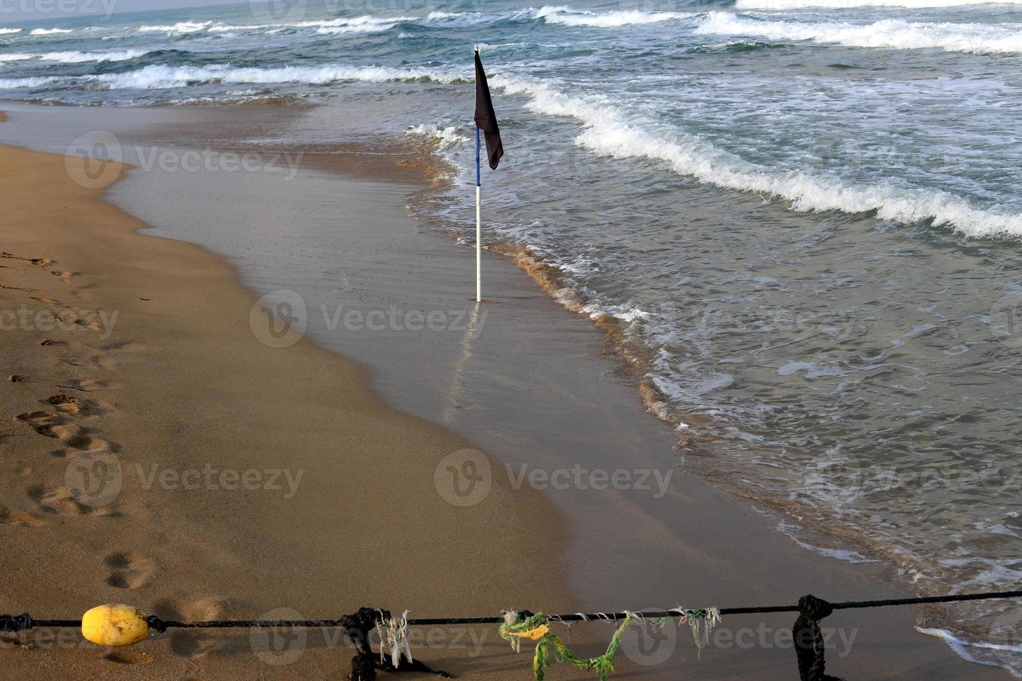 A rope with floats to secure a safe swimming area on the beach. photo