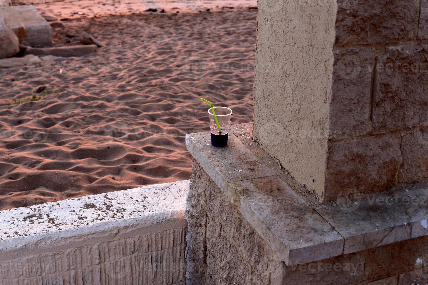 On the table in a glass of soft drinks. photo