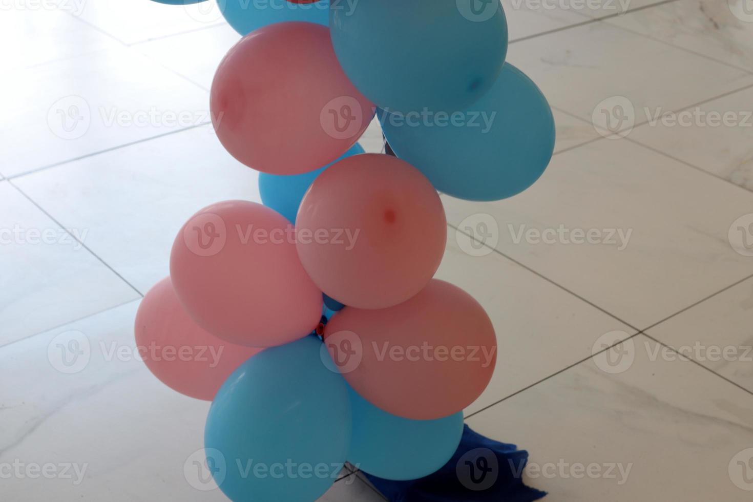 Balloons in a city park on the seashore. photo