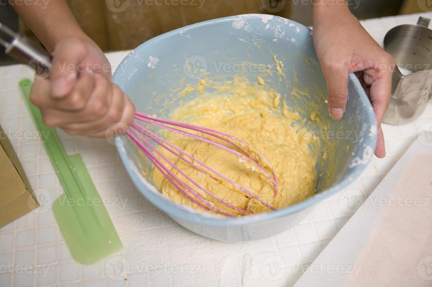 Close up of Young beautiful woman is baking in her kitchen , bakery and coffee shop business photo