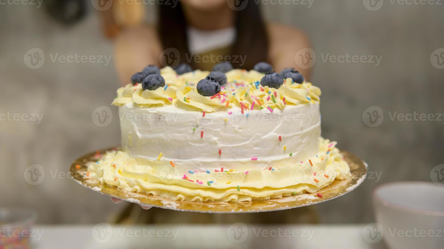 Close up of Young beautiful woman is baking in her kitchen , bakery and coffee shop business photo