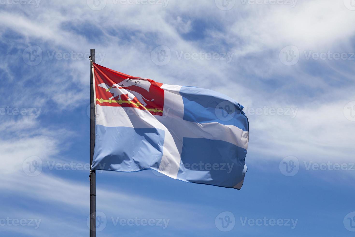 Flag of Saint Malo waving in mid air photo