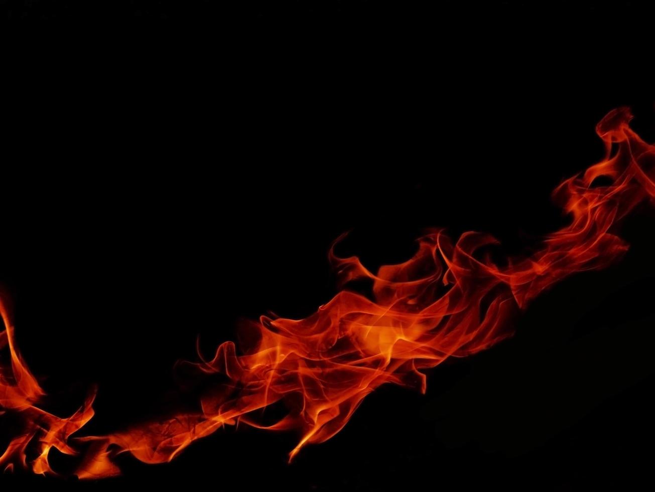 Flame Flame Texture For Strange Shape Fire Background Flame meat that is burned from the stove or from cooking. danger feeling abstract black background Suitable for banners or advertisements. photo